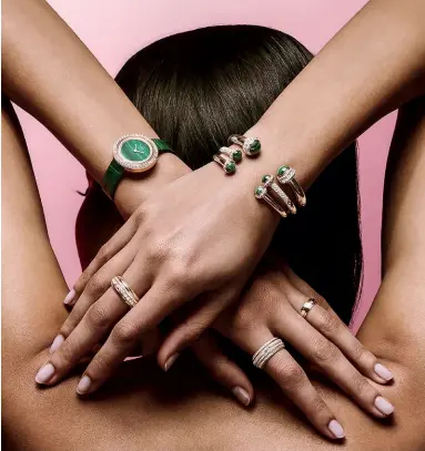  ??  ?? Watch in rose gold set with malachite and diamonds; bangles in rose gold set with malachite cabochons and diamonds; rings in rose gold set with diamonds, all from the Possession collection by Piaget