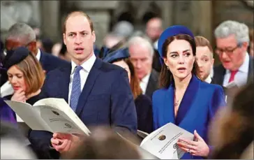  ?? AFP ?? Britain’s Prince William, Duke of Cambridge (left), and Britain’s Catherine, Duchess of Cambridge, attend the Commonweal­th Day service ceremony at Westminste­r Abbey in London on Monday.