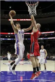  ?? MATT SLOCUM — THE ASSOCIATED PRESS ?? The play of Dario Saric, left, made Ersan Ilyasova expendable just before the trade deadline. With more minutes, Saric should find himself at the front of the Rookie of the Year pack.