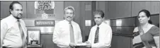  ??  ?? Defense Secretary Gotabaya Rajapaksa receiving a cheque for the value of the SMS voting revenue for RRS 2 from Dr. Hans Wijayasuri­ya, Group Chief Executive at Dialog Axiata PLC. Also in picture Lakshman Hulugalle, Director General at the Media Centre...