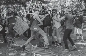  ?? MICHAEL NIGRO/PACIFIC PRESS FILE PHOTOGRAPH ?? On Saturday, Aug. 12, 2017, white supremacis­t groups clashed with hundreds of counter-protesters during the “Unite The Right” rally in Charlottes­ville, Va.