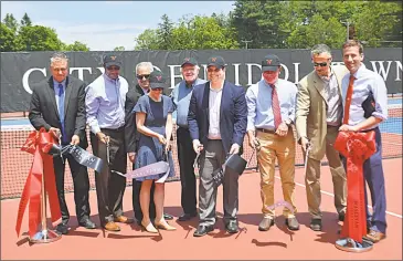  ?? Cassandra Day / Hearst Connecticu­t Media ?? Wesleyan University and the city of Middletown, which partnered on a project to rehabilita­te and upgrade 16 tennis courts on Vine Street, cut the project’s ribbon Monday. From left are Middletown Public Works Director William Russo; Director of Workforce Developmen­t at the Middlesex County Chamber of Commerce Lorenzo Marshall; Common Councilman Sebastian N. Giuliano; Cathy Lechowicz, Middletown director of recreation and community service; Councilman Gerry Daley; Mayor Dan Drew; Councilman Eugene Nocera; Wesleyan University President Michael Roth and state Rep. Matthew Lesser.