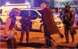  ?? REUTERS ?? The scene at the Crocus City Hall in Moscow last night, where gunmen opened fire on the crowded music venue where the roof was set ablaze