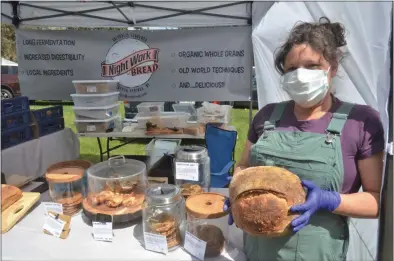  ?? LAUREN HALLIGAN — MEDIANEWS GROUP ?? NightWork Bread Co. cofounder Cindy Rosenberg represents the company at the Spa City Farmers’ Market.