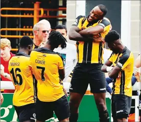  ?? PICTURE: Max Flego ?? EASY DOES IT: Shamir Mullings leads the goal celebratio­ns