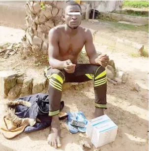  ?? Photo: DHQ ?? A suspected drug peddler during his arrest by troops of Forward Operation Base with alleged 20 packets of Pentazocin­e injection concealed in his motorcycle at Kungurmi village of Bungudu L.G.A in Zamfara
State. The military accused him of supplying hard drugs to bandits