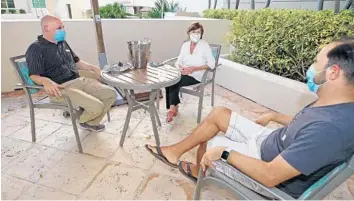  ?? JOHN MCCALL/SOUTH FLORIDA SUN SENTINEL ?? Maddy Soriano sits with her two sons, Ben, left, and Marc, at her retirement community Vi at Aventura on Wednesday.