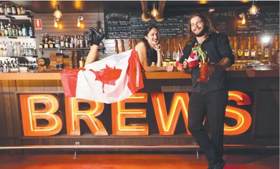  ?? Picture: GLENN HAMPSON ?? House of Brews staff members Jessy Thomsen and Mackenzie Close get prepared to make the Canadian team feel at home.