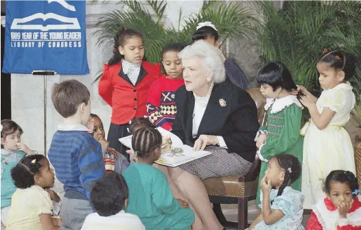  ?? AP FILE PHOTO ?? A STORIED LIFE: Barbara Bush reads to day care students at the Library of Congress in 1989, just weeks after moving into the White House. A literacy effort she launched took in tens of millions of dollars, with Bush in an active role until months...