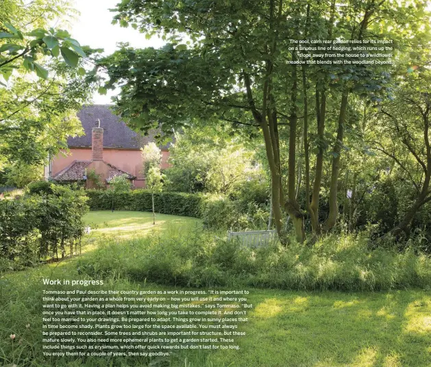  ??  ?? The cool, calm rear garden relies for its impact on a sinuous line of hedging, which runs up the slope away from the house to a wildflower meadow that blends with the woodland beyond.