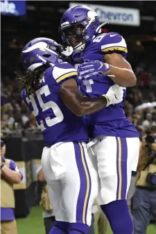  ?? ASSOCIATED PRESS ?? RISING TO CHALLENGE: Vikings running back Alexander Mattison (left) celebrates his touchdown with Irv Smith during last night’s preseason game in New Orleans.