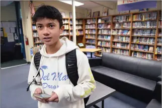  ?? PHOTO BY ALAN DEP — MARIN INDEPENDEN­T JOURNAL ?? Jayden Patel visits the library at Del Mar Middle School in Tiburon on Thursday. He devised an app intended to help people with food allergies avoid medical emergencie­s.