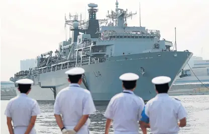  ?? /Reuters ?? Rough sailing: HMS Albion, a British Royal Navy amphibious assault ship, arrives at Harumi Pier in Tokyo on August 3.