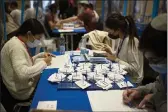  ?? MAYA ALLERUZZO — THE ASSOCIATED PRESS ?? Workers count votes in Israel’s national elections at the Knesset in Jerusalem on Thursday.
