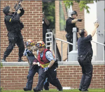  ?? MARK DUNCAN / AP FILE 2013 ?? A 2015 review finds that eight years after the Virginia Tech massacre led to tighter security at U.S. colleges, some schools make “active shooter” training mandatory for incoming students, and others leave policies up to schools to develop.