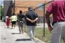  ??  ?? A testing side in the Austin neighborho­od in Chicago. Communitie­s of color have been disproport­ionately affected by Covid-19. Photograph: Scott Olson/Getty Images