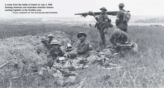  ?? Picture: COURTESY OF THE AUSTRALIAN WAR MEMORIAL ?? A scene from the battle of Hamel on July 4, 1918 showing American and Australian stretcher bearers working together in the frontline area.