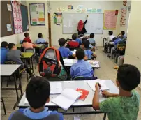  ?? Reuters ?? Palestinia­n children attend a class in a school in the East Jerusalem neighbourh­ood of Jabel Mukhaber. —