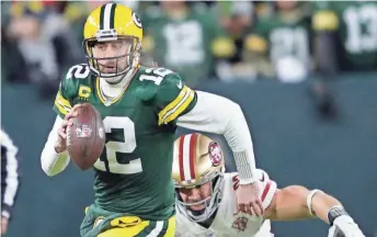  ?? DAN POWERS / USA TODAY ?? Trading quarterbac­k Aaron Rodgers could give the Packers some high draft picks that they could use to help bolster their defense.