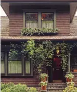  ??  ?? ABOVE Screwed into the house framing, one long box spans two upstairs windows. RIGHT This upstairs box is fastened to decorative brackets firmly anchored into the wall. BELOW Rail boxes may hang from the porch rail, or sit on top of it, depending on...