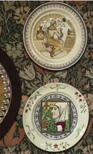  ??  ?? LEFT Collectibl­e transferwa­re plates by Moyr Smith hang against a wall papered in ‘Compton’, designed by Henry Dearle for Morris & Co in 1896.