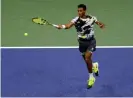  ?? Photograph: Jason Szenes/EPA ?? Félix Auger-Aliassime hits a return in his straight-sets defeat of Andy Murray.