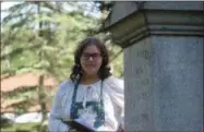  ?? CHARLES PRITCHARD - ONEIDA DAILY DISPATCH ?? Eliza Colvin takes on the role of Maud Bortle and stands near the grave before recounting her story on the Glenwood Cemetery tour on Saturday, June 8, 2019.