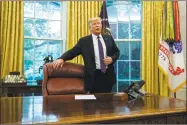  ?? Evan Vucci / Associated Press ?? President Donald Trump arrives for a phone call with Mexican President Enrique Pena Nieto in the Oval Office of the White House on Monday.