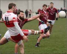  ??  ?? Matty Forde of Kilanerin gets his kick away despite the blocking attempt by Castletown’s Conor Carty.