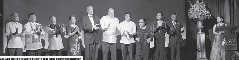  ?? ?? AWARDEES all: Filipino awardees beam with pride during the recognitio­n ceremony.