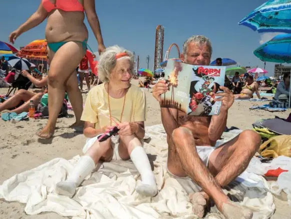  ?? DONATO DI CAMILLO ?? Donato Di Camillo’s image of an elderly couple enjoying the sunshine was taken on Coney Island beach with the iconic Wonder Wheel in the background, part of his “Beach Body Bingo” series.