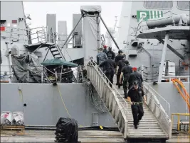  ?? Eugene Hoshiko ?? The Associated Press U.S. military personnel work onboard Sunday the damaged USS Fitzgerald at the U.S. naval base in Yokosuka, Japan.