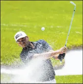  ?? Emil Lippe The Associated Press ?? Sebastian Munoz hits out of a bunker to the sixth green Saturday in the AT&T Byron Nelson’s third round at TPC Craig Ranch. He hit the shot for eagle.