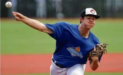  ?? JONATHAN WIGGS/GLOBE STAFF ?? Northeast pitcher Drew Lane rears back to deliver the heat at the Bay State Games.