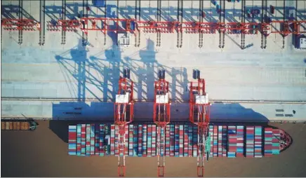 ?? XU CONGJUN / FOR CHINA DAILY ?? The world’s largest container port, in Hangzhou Bay south of Shanghai, is run by the Shanghai Internatio­nal Port Group.