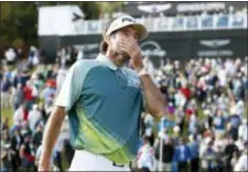  ?? RYAN KANG — THE ASSOCIATED PRESS ?? Bubba Watson reacts on the 18th green after winning the Genesis Open tournament at Riviera Country Club Sunday.