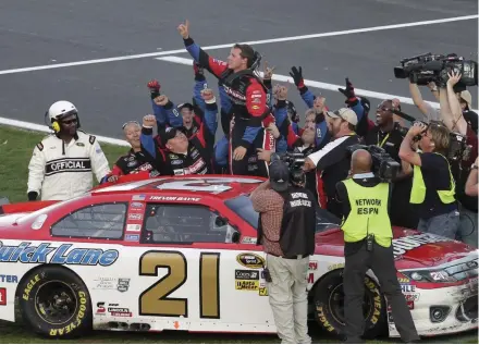  ?? [AP/DAVID GRAHAM] ?? Trevor Bayne, top, celebrates after winning the 2011 Daytona 500.