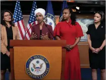  ?? J. SCOTT APPLEWHITE — THE ASSOCIATED PRESS ?? U.S. Rep. Ilhan Omar, D-minn speaks, as U.S. Reps., from left, Rashida Tlaib, D-mich., Ayanna Pressley, D-mass., and Alexandria Ocasiocort­ez, D-N.Y., listen, during a news conference at the Capitol in Washington, in 2019.