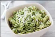 ?? CARL TREMBLAY — AMERICA’S TEST KITCHEN VIA ASSOCIATED PRESS ?? This undated photo provided by America’s Test Kitchen in July 2018 shows pasta with kale and sunflower seed pesto in Brookline, Mass. This recipe appears in the cookbook “Cooking At Home With Bridget And Julia.”