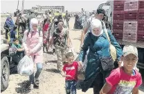  ?? PHOTO: REUTERS ?? People flee with their belongings in Daraa countrysid­e, Syria in this image released yesterday.