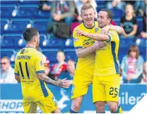  ??  ?? ■ Christophe­r Kane celebrates with team-mates.