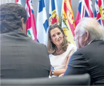  ?? CHRIS YOUNG/THE CANADIAN PRESS ?? Foreign Affairs Minister Chrystia Freeland, centre, sits with Unifor President Jerry Dias, left, and United Auto Workers President Dennis Williams in Toronto on Friday, ahead of discussion­s over the preparatio­n for the upcoming round of North American...