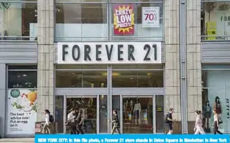  ??  ?? NEW YORK CITY: In this file photo, a Forever 21 store stands in Union Square in Manhattan in New York City. Global fast-fashion retailer Forever 21 said it was filing for voluntary bankruptcy on Sunday,— AFP