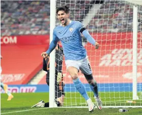  ??  ?? Manchester City’s John Stones celebrates scoring against Manchester United