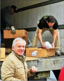  ?? TRENTONIAN FILE PHOTO ?? Former Sen Bob Torricelli smiles as volunteers ready turkeys to be handed to one of 500 Trentonian’s who made it to the former senator’s Rosemont Foundation’s free turkey giveaway at the former site of the Pete Lorenzo’s Cafe directly across the street...