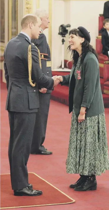  ??  ?? 0 Return to royal duties: Prince William presents a MBE to musician Anna Meredith, former composer-in-residence with the BBC Scottish Symphony Orchestra, at Buckingham Palace