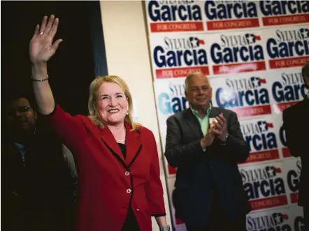  ?? Marie D. De Jesus / Houston Chronicle ?? Sylvia Garcia is cheered by the man she hopes to replace, U.S. Rep. Gene Green, as she arrives at her campaign headquarte­rs on Tuesday night. Garcia held a commanding lead in the primary race for the 29th District seat being vacated by the retiring...