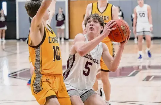  ?? Photos by Jim Franco/times Union ?? Stillwater senior Lukas Lilac goes up for a shot against Canton. Lilac had seven points, five rebounds and four assists.