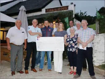  ??  ?? Pictured at the presentati­on of the Coolkenno GAA Club lotto cheque to Cathal Rossiter at The Dying Cow were, front: Ned Rossiter, Eamonn Dolan, Cathal Rossiter, Tracy Rossiter, Helen Rossiter, John Keogh. Back: Eamonn Rossiter, Robert Keogh, Myles...