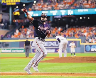  ?? MATT SLOCUM/ASSOCIATED PRESS ?? Washington Nationals’ Adam Eaton celebrates after hitting a home run during the Nationals’ 12-3 victorty against the Houston Astros at Minute Maid Park on Wednesday.